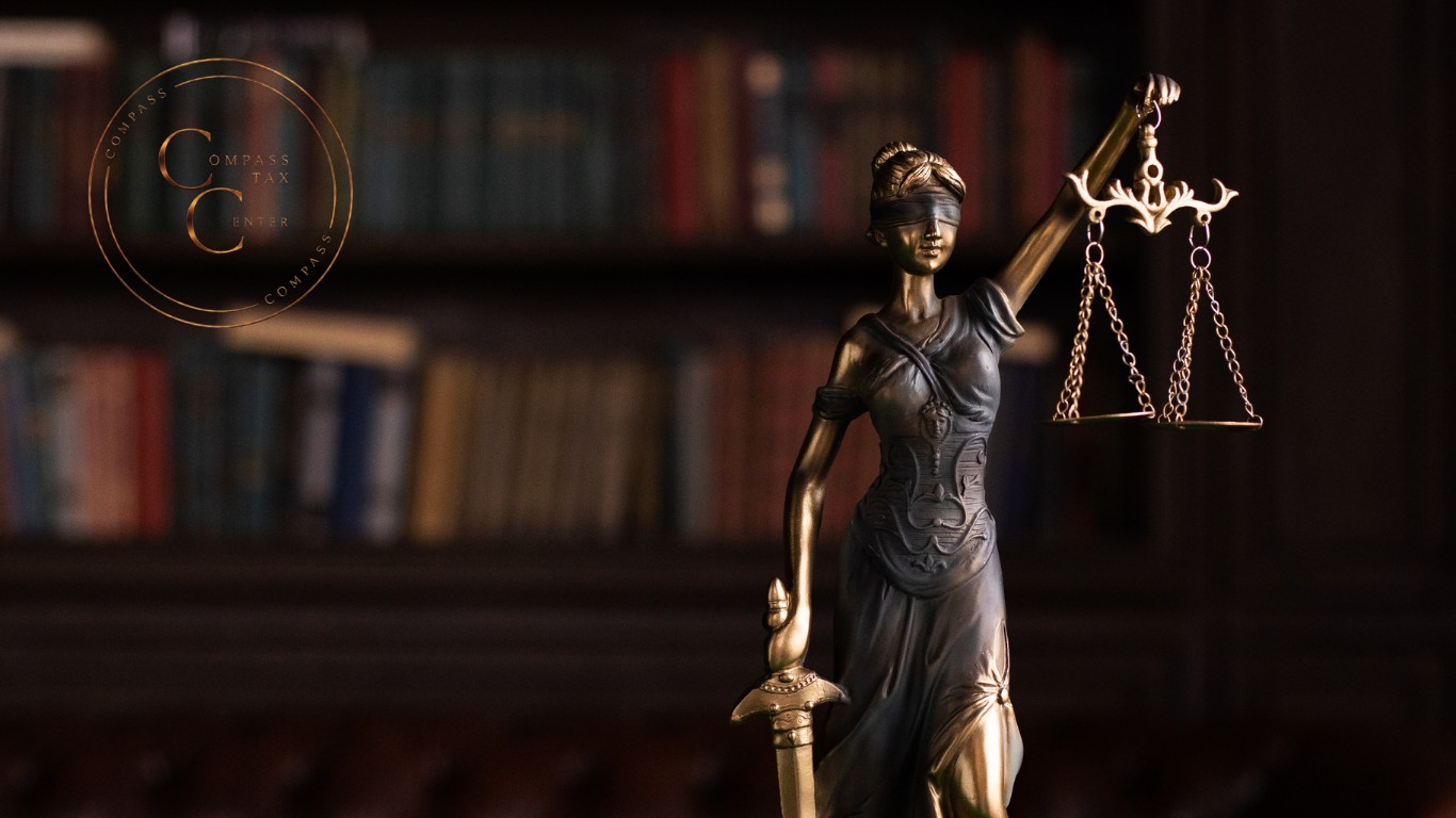 Lady Justice holding the scales of justice — Compass Tax Center