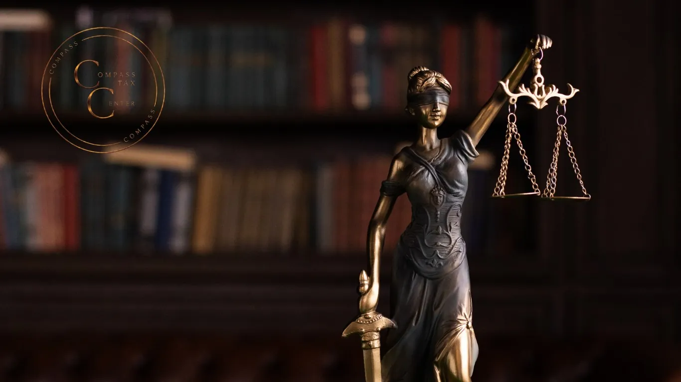 Lady Justice holding the scales of justice — Compass Tax Center